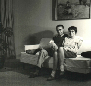 A photograph of Andy & Eva Grove taken a long time ago, they are sitting on a couch